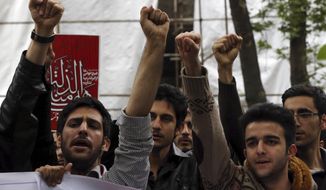 Iranian university students chant slogans in an anti-Saudi protest in front of the U.N. office in Tehran. (AP Photo/File)
