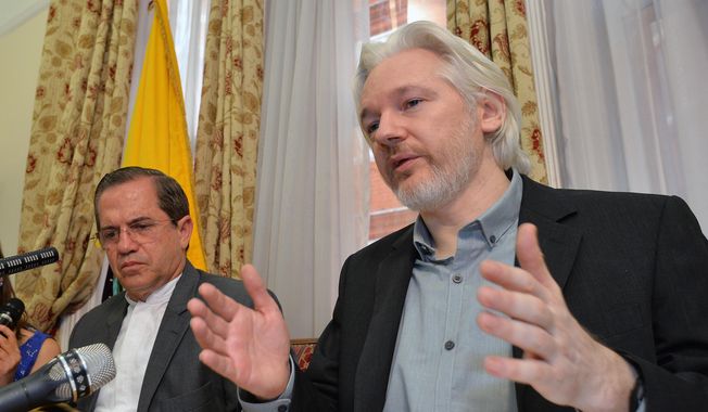 Ecuador&#x27;s Foreign Minister Ricardo Patino, left, and WikiLeaks founder Julian Assange speak during a news conference inside the Ecuadorian Embassy in London in this Aug. 18, 2014, file photo. (John Stillwell/Pool Photo via AP, File)