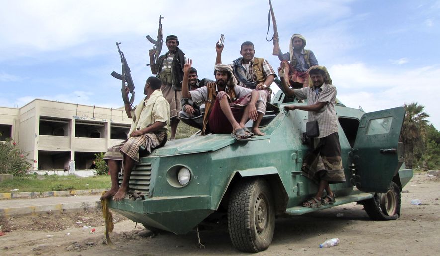 Militiamen loyal to President Abed Rabbo Mansour Hadi ride on an army vehicle on a street in Aden, Yemen, on March 20, 2015. Yemen&#39;s Shiite rebels, backed by supporters of former President Ali Abdullah Saleh, have seized the third-largest city after capturing the capital Sanaa in September, effectively splitting the country in half and hindering U.S. efforts to combat a powerful local al Qaeda affiliate. Hadi, a close U.S. ally, fled house arrest in Sanaa last month and has set up a base in the port city of Aden, the former capital of the once-independent south. (Associated Press) **FILE**