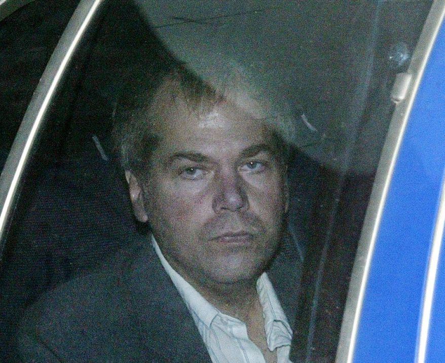 ADVANCE FOR SUNDAY, APRIL 19 AND THEREAFTER - FILE - In this Nov. 18, 2003 file photo, John Hinckley Jr. arrives at U.S. District Court in Washington. The last man to shoot an American president now spends most of the year in a house overlooking the 13th hole of a golf course in a gated community. He takes long walks along tree-lined paths, plays guitar and paints, grabs fast food at Wendy’s. He drives around town in a silver Toyota Avalon, a car that wouldn’t attract a second glance. Often, as if to avoid detection, he puts on a hat or visor before going out. (AP Photo/Evan Vucci, File)