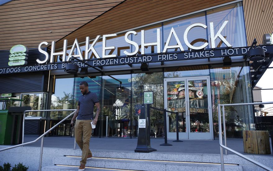 In this April 15, 2015, photo, the Shake Shack is seen in front of the New York-New York hotel and casino in Las Vegas. (AP Photo/John Locher)