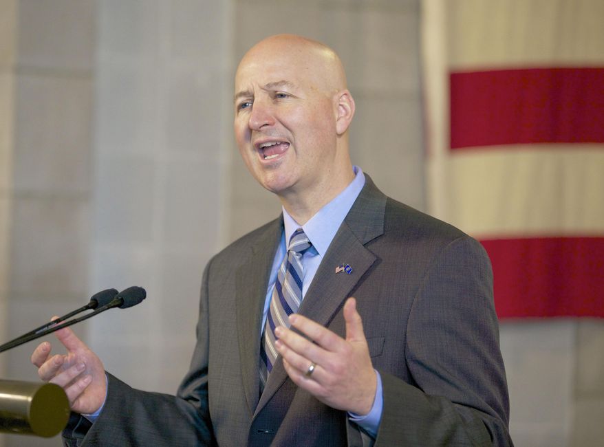 Neb. Gov. Pete Ricketts speaks in Lincoln, Neb., Friday, April 17, 2015. Gov. Ricketts defended Nebraska's death penalty, arguing that the state has used it "more judiciously" than Texas and that it should be preserved. His comments came one day after lawmakers gave first-round approval to a bill that would end capital punishment. (AP Photo/Nati Harnik)
