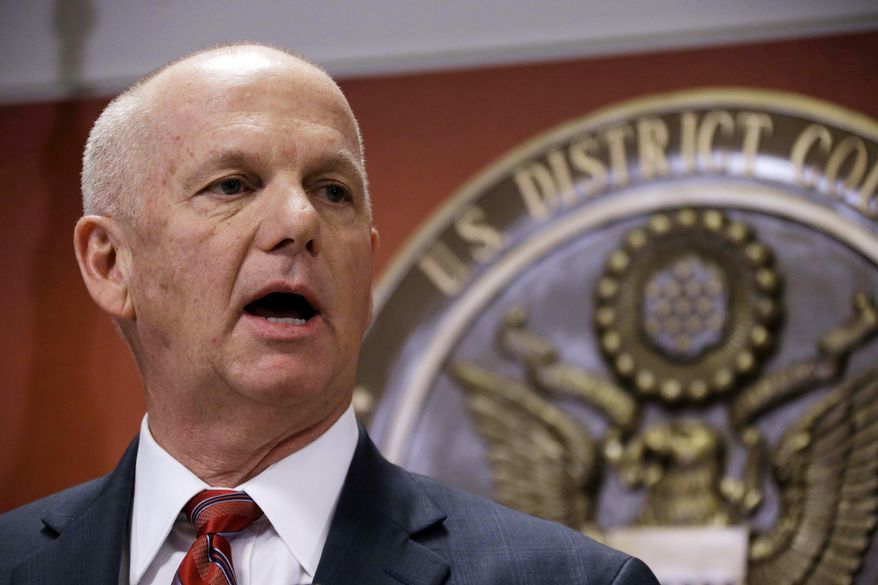 FILE - In this Friday, March 22, 2013, file photo, United States Attorney David J. Hickton speaks at a news conference, in Pittsburgh. The Justice Department announced Friday, April 17, 2015, that Hickton has been picked to co-chair a national Heroin Task Force. (AP Photo/Gene J. Puskar, File)