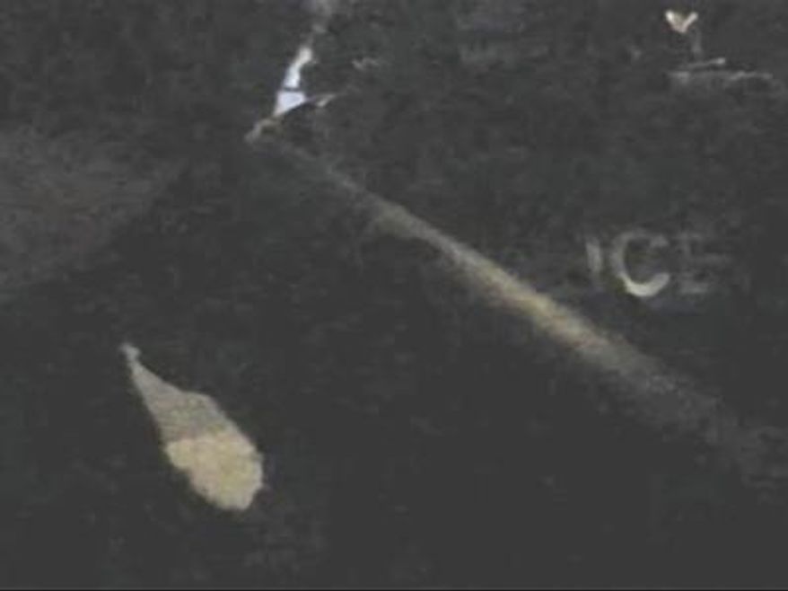 This photo provided by St. Louis County Police shows a still frame from the police body cam video from a fatal police shooting on Saturday, April 18, 2015 in Jennings, Mo. Authorities said Saturday that police officers shot and killed Thaddeus McCarroll, 23, after he charged at them with a knife. Initially, tactical officers fired a “less lethal round” at McCarroll to disarm him. But police said that McCarroll didn’t stop and ran full speed toward the officers with the knife still in hand. Two officers shot McCarroll multiple times, and he died at the scene. Footage from the body camera of one of the tactical officers was uploaded to the department’s YouTube page. Police Chief Jon Belmar described the shooting in a written statement as “another tragic situation where police officers had no other option than to use deadly force against an armed subject.” (AP Photo/St. Louis County Police)