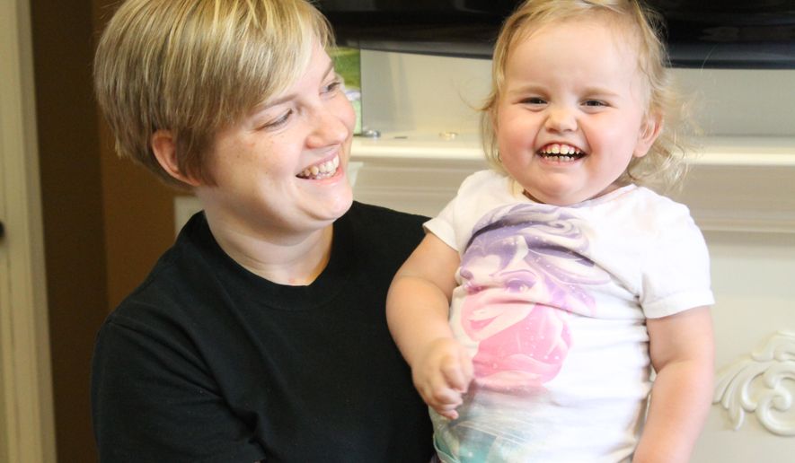 In this undated photo Janna Ferrall poses for a photo with her daughter Aubrey in Milan, Tenn. Aubrey was diagnosed with congenital nephrotic syndrome, a rare kidney disease. In January, Aubrey had to have her second kidney removed. She now has a dialysis catheter in her abdomen and has to go through dialysis every night. Aubrey needs a kidney transplant for her body to work normally. (Nathan Handley/The Jackson Sun via AP) NO SALES