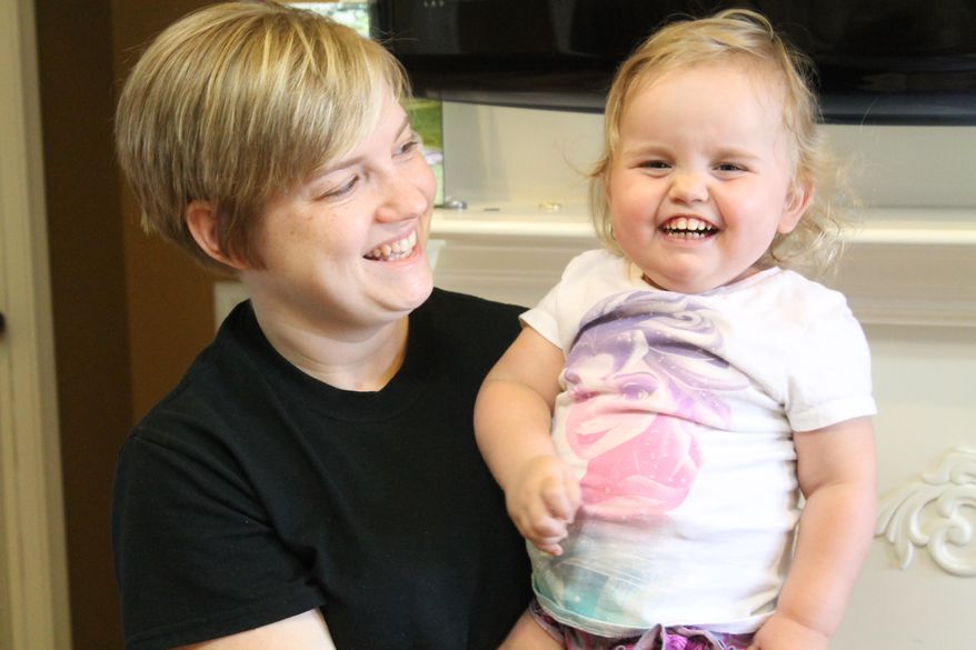 In this undated photo Janna Ferrall poses for a photo with her daughter Aubrey in Milan, Tenn. Aubrey was diagnosed with congenital nephrotic syndrome, a rare kidney disease. In January, Aubrey had to have her second kidney removed. She now has a dialysis catheter in her abdomen and has to go through dialysis every night. Aubrey needs a kidney transplant for her body to work normally. (Nathan Handley/The Jackson Sun via AP) NO SALES