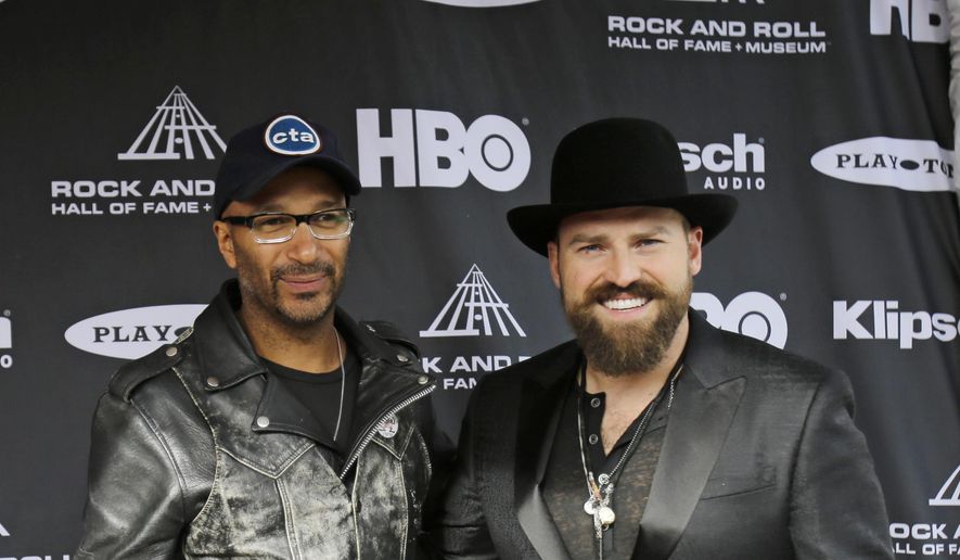 Tom Morello (left), formally of Rage Against the Machine, and Zac Brown arrive at the Rock and Roll Hall of Fame Induction Ceremony Saturday, April 18, 2015, in Cleveland. (AP Photo/Tony Dejak) ** FILE **