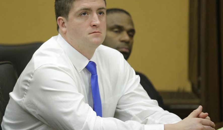 In a Monday, April 6, 2015 file photo, Cleveland police officer Michael Brelo listens to opening arguments in Cleveland in his trial on voluntary manslaughter charges in the deaths of two unarmed motorists after a high-speed chase. The circumstances of a police shooting trial unfolding in a Cleveland courtroom share similarities to a high-speed chase and fatal shooting in Tennessee as well as the matters of law on which the Cleveland case will be decided: When does a threat to officers’ lives end? (AP Photo/Tony Dejak, Pool, File)
