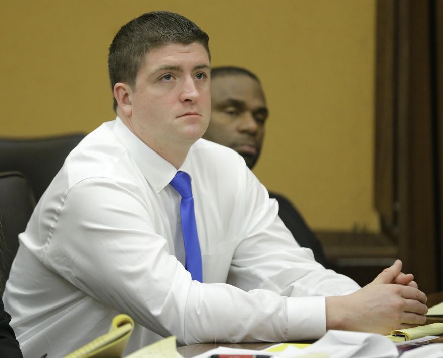 In a Monday, April 6, 2015 file photo, Cleveland police officer Michael Brelo listens to opening arguments in Cleveland in his trial on voluntary manslaughter charges in the deaths of two unarmed motorists after a high-speed chase. The circumstances of a police shooting trial unfolding in a Cleveland courtroom share similarities to a high-speed chase and fatal shooting in Tennessee as well as the matters of law on which the Cleveland case will be decided: When does a threat to officers’ lives end? (AP Photo/Tony Dejak, Pool, File)