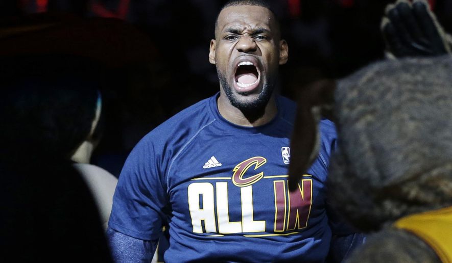 Cleveland Cavaliers&#x27; LeBron James is introduced before a first round NBA playoff basketball game against the Boston Celtics, Sunday, April 19, 2015, in Cleveland. (AP Photo/Mark Duncan)