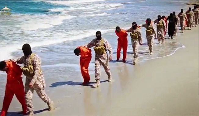 This undated image made from a video released by Islamic State militants, Sunday, April 19, 2015, shows a group of captured Ethiopian Christians taken to a beach before they were killed by Islamic State militants, in Libya. (Associated Press) ** FILE **