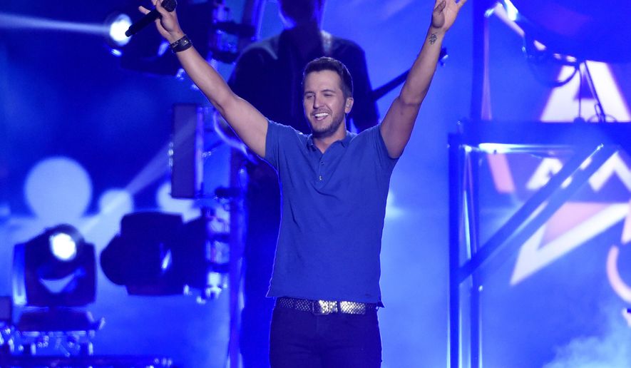 Luke Bryan performs at the 50th annual Academy of Country Music Awards at AT&T Stadium on Sunday, April 19, 2015, in Arlington, Texas. (Photo by Chris Pizzello/Invision/AP)