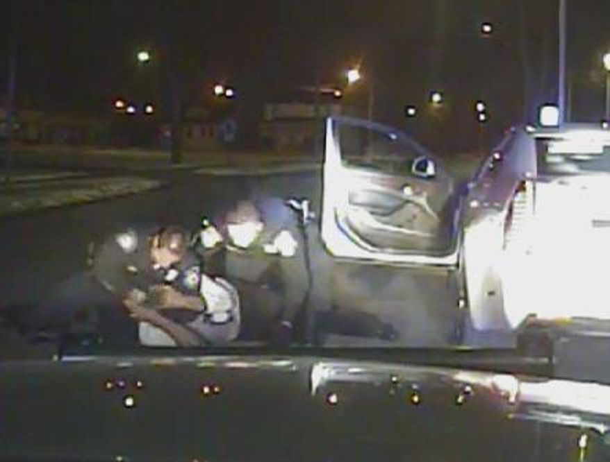 FILE - In this Jan. 28, 2015, file frame grab from a dashcam video provided by the Inkster Police Department, an officer punches Floyd Dent many times in the head while another officer tries to handcuff Dent, who is on the ground in Inkster, Mich. A prosecutor filed charges Monday, April 20, 2015, against the police officer who pulled Dent from his car during the traffic stop and beat him. (Inkster Police Department/Detroit News via AP, File)
