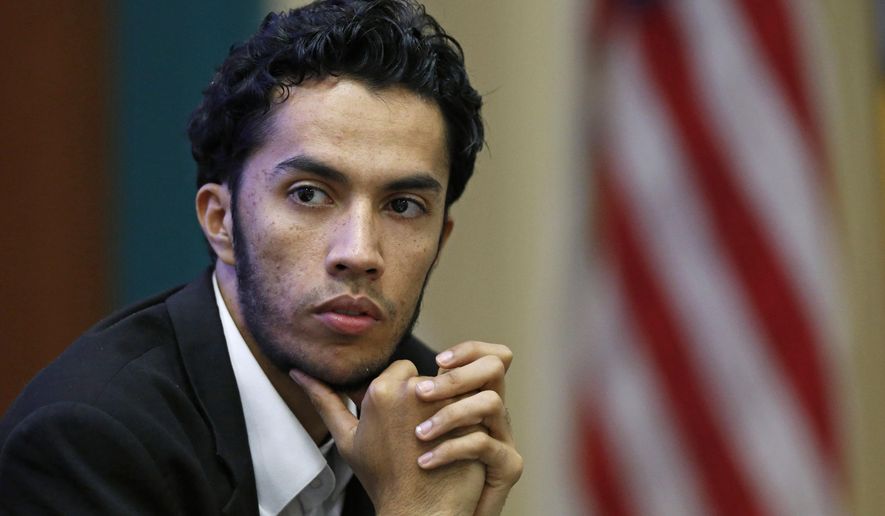 In this March, 27, 2015 photo,Youssef Edghouch listens during a discussion on American Muslims and civic engagement from the local to the national level, at the Islamic Center of San Gabriel Valley in Rowland Heights, Calif. The Obama administration has launched a pilot program in several cities charged with tackling global terrorism on a local scale by preventing radicalization from taking root. If the efforts are successful, they would be rolled out nationwide. (AP Photo/Christine Cotter)