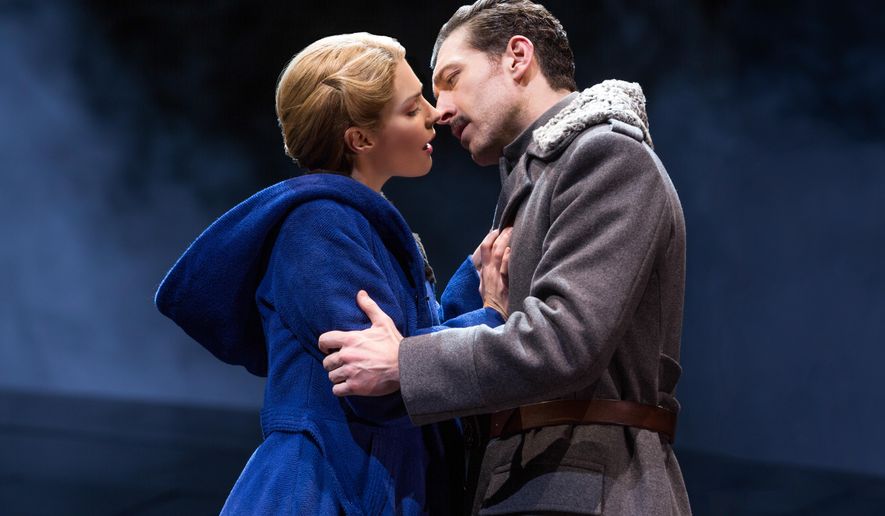 This photo provided by Polk & Co., Kelli Barrett and Tam Mutu in a scene from the play "Doctor Zhivago" in New York. Barrett, who has been on Broadway in "Wicked," "The Royal Family" and "Baby It's You!" this month takes her biggest acting step _ playing Lara in the new musical of "Doctor Zhivago" directed by Des McAnuff. Boris Pasternak's Nobel Prize-winning tale of five intertwined lovers during the Russian civil war was made into a 1965 film version starring Omar Sharif and Julie Christie. (Matthew Murphy via AP)