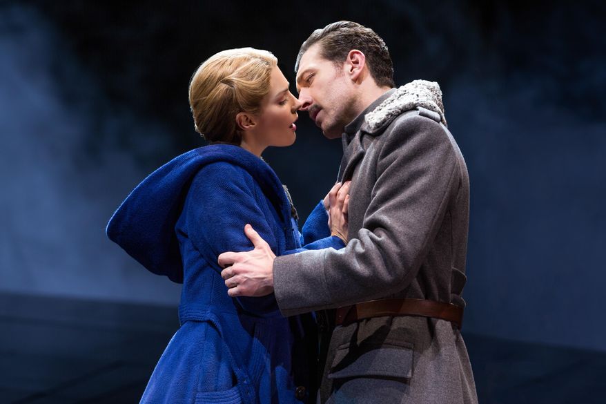 This photo provided by Polk & Co., Kelli Barrett and Tam Mutu in a scene from the play "Doctor Zhivago" in New York. Barrett, who has been on Broadway in "Wicked," "The Royal Family" and "Baby It's You!" this month takes her biggest acting step _ playing Lara in the new musical of "Doctor Zhivago" directed by Des McAnuff. Boris Pasternak's Nobel Prize-winning tale of five intertwined lovers during the Russian civil war was made into a 1965 film version starring Omar Sharif and Julie Christie. (Matthew Murphy via AP)