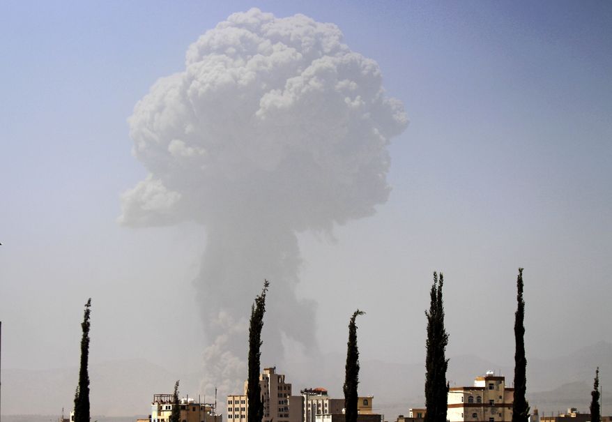 Smoke rises after a Saudi-led airstrike hit a site where many believe the largest weapons cache in Yemen's capital, Sanaa, is located on Monday, April 20, 2015. Powerful explosions rocked the Yemeni capital early Monday morning amid the strike, shattering windows and waking residents up. (AP Photo/Hani Mohammed)