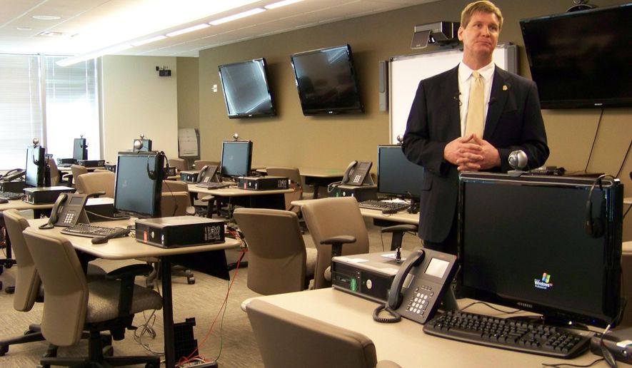 File- This March 9, 2012, file photo shows FBI spokesman Kyle Loven giving a tour of the Emergency Operations Center at the new Minneapolis-area field office in Brooklyn Center, Minn. Loven, spokesman for the Minneapolis office of the FBI, said six people were arrested Sunday, April 19, 2015, but gave no further details. An FBI spokesman in San Diego referred questions to Loven. (AP Photo/Amy Forliti, File)