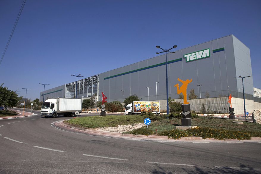 FILE - In this Oct. 16, 2013 file photo, trucks run past Teva Pharmaceutical Logistic Center in the town of Shoam, Israel. On Tuesday, April 21, 2015, Teva has offered to buy Mylan for about $40.1 billion in cash and stock in a deal that would create a powerhouse of generic drug development. (AP Photo/Dan Balilty, File)