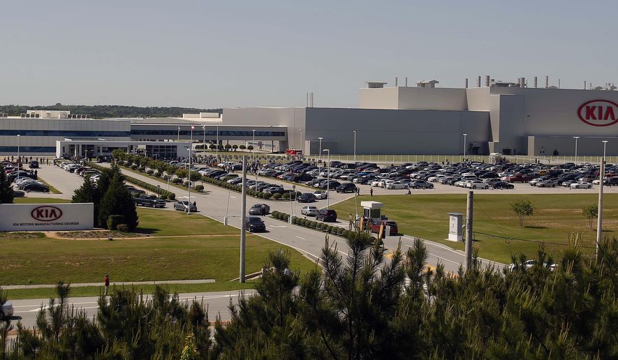 Authorities investigate after a shooting at a Kia Motors automobile plant Tuesday, April 21, 2015, in West Point, Ga. Troup County sheriff's Sgt. Stewart Smith, who confirmed the shooting Tuesday, said one person was wounded and had been taken to a hospital by helicopter. He said authorities had a lone suspect in custody. (Todd J. Van Emst/Opelika-Auburn News via AP) MANDATORY CREDIT