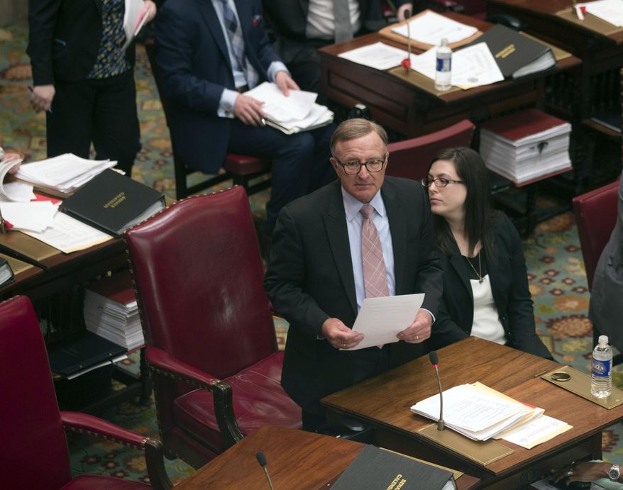 Sen. John DeFrancisco, R-Syracuse, speaks in the Senate Chamber at the Capitol, Tuesday, April 21, 2015, in Albany, N.Y. Republican lawmakers are backing Senate Leader Dean Skelos amid a federal investigation into whether he influenced Nassau County's decision to award a $12 million contract to a company that hired his son. (AP Photo/Mike Groll)