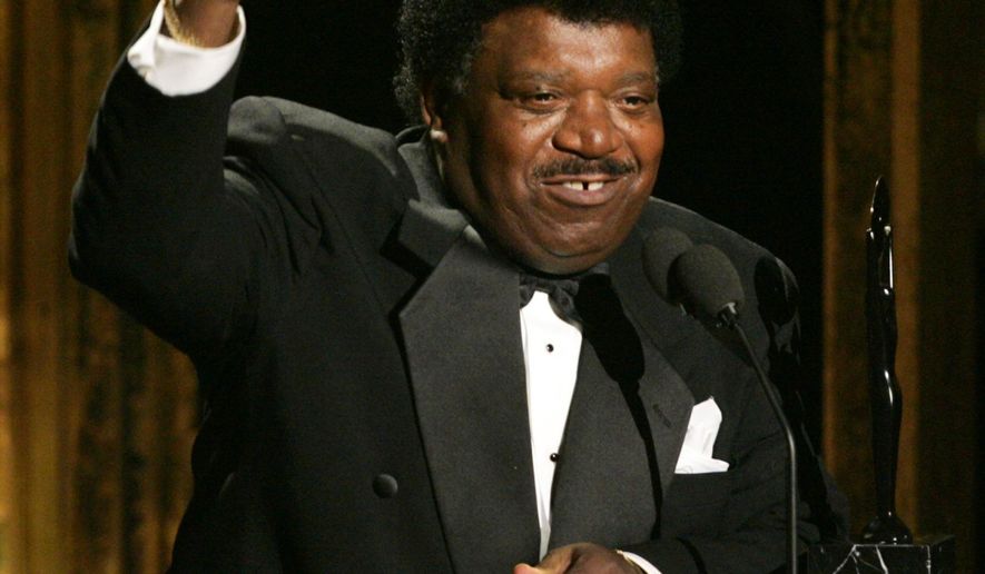 FILE - In this March 14, 2005 file photo, Percy Sledge accepts his award during the Rock and Roll Hall of Fame induction ceremony in New York. Sledge was remembered for phenomenal talent and extraordinary kindness during a funeral service on Tuesday, April 21, 2015, in Baker, La. Sledge, who recorded the classic 1966 soul ballad "When a Man Loves a Woman," died, April 14, at the age of 74. (AP Photo/Julie Jacobson, File)