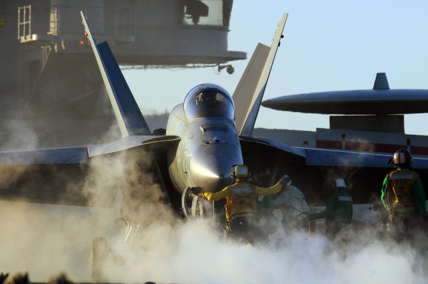 An F/A-18E Super Hornet assigned to the Eagles of Strike Fighter Squadron (VFA) 115 is prepared for take-off from the aircraft carrier USS George Washington (CVN 73).  U.S. Navy photo.