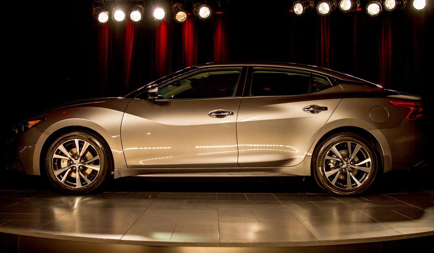 A redesigned version of the Nissan Maxima is displayed at the Japanese automaker's assembly plant in Smyrna, Tenn., on Tuesday, April 21, 2015. The Japanese automaker is promoting the sporty nature of the new version of its flagship sedan. (AP Photo/Erik Schelzig)