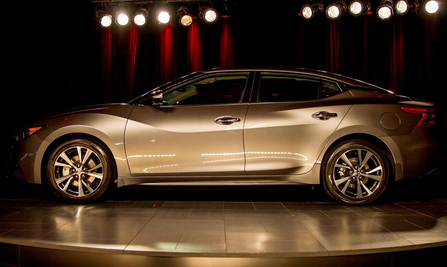 A redesigned version of the Nissan Maxima is displayed at the Japanese automaker's assembly plant in Smyrna, Tenn., on Tuesday, April 21, 2015. The Japanese automaker is promoting the sporty nature of the new version of its flagship sedan. (AP Photo/Erik Schelzig)