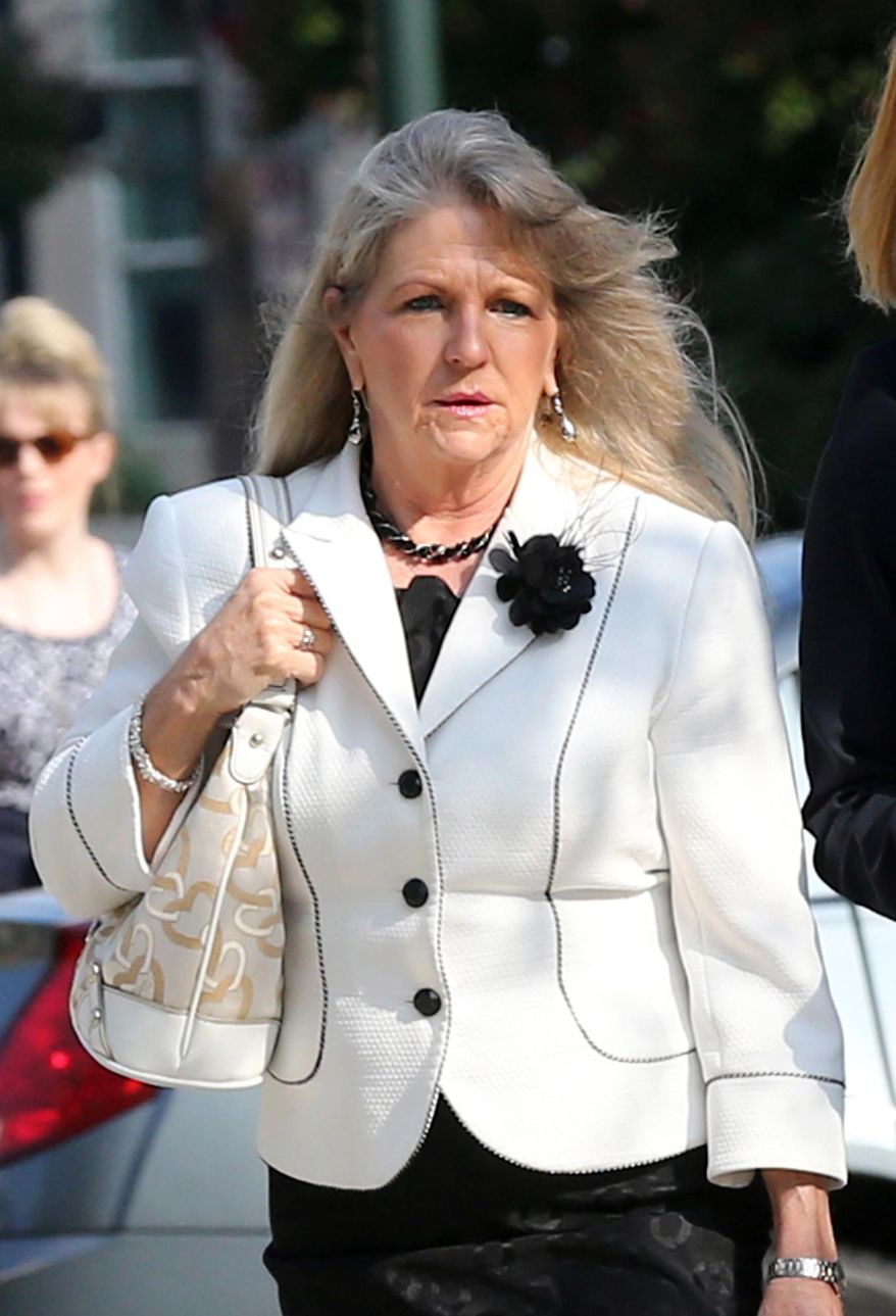 File-This Aug. 6, 2014, file photo shows former first lady Maureen McDonnell heading into the federal courthouse in Richmond, Va. The former Virginia first lady's legal team said in court filings Monday, April 20, 2015, that her convictions on several public corruption charges are based on an overly broad definition of bribery and that she did not receive a fair trial owing to mistakes by the presiding federal judge. (Bob Brown/Richmond Times-Dispatch via AP, File)
