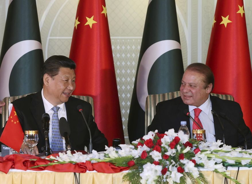 In this April 20, 2015 photo released by China's Xinhua News Agency, visiting Chinese President Xi Jinping, left and Pakistan's Prime Minister Nawaz Sharif attend a press conference after their talks in Islamabad, Pakistan. Xi is on a two-day visit in which he is expected to announce $45 billion worth of investment projects in energy and infrastructure development. (Lan Hongguang/Xinhua via AP) NO SALES