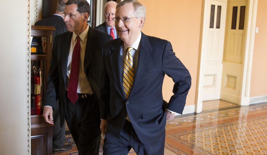 Senate Majority Leader Mitch McConnell, R- Ky., right, walks with Sen. John Barrasso, R-Wyo., left, and Senate Majority Whip John Cornyn of Texas, center, to a news conference on Capitol Hill in Washington, Tuesday, April 21, 2015. Republican and Democratic lawmakers talked about putting the final touches on a human trafficking bill, and turning their attention to Attorney General nominee Loretta Lynch. (AP Photo/Evan Vucci)