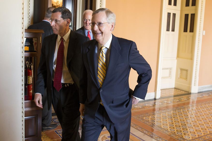 Senate Majority Leader Mitch McConnell, R- Ky., right, walks with Sen. John Barrasso, R-Wyo., left, and Senate Majority Whip John Cornyn of Texas, center, to a news conference on Capitol Hill in Washington, Tuesday, April 21, 2015. Republican and Democratic lawmakers talked about putting the final touches on a human trafficking bill, and turning their attention to Attorney General nominee Loretta Lynch. (AP Photo/Evan Vucci)