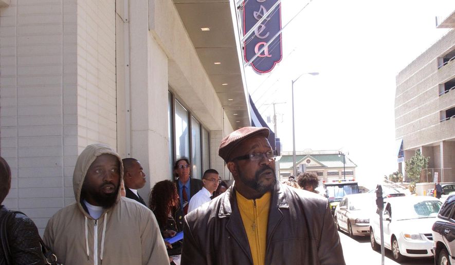 Ronald Roberts, right, waits at the head of the line of applicants for jobs at the Chelsea hotel in Atlantic City N.J. on Wednesday April 22, 2015. Roberts lost his cook's job last August when the Showboat casino closed. Many laid-off casino workers were among those seeking jobs at the Chelsea. Chelsea owner Curtis Bashaw said most of the positions are seasonal summer jobs, but added some of the best hires will be kept on permanently. (AP Photo/Wayne Parry)