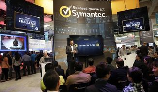 In this file photo, a presentation is made in the Symantec booth during the RSA Conference on Wednesday, April 22, 2015, in San Francisco. The cybersecurity firm says destructive cyberattacks against Ukraine this week ahead of Russia’s invasion were made possible by digital intrusions starting in 2021. The company said ransomware is used as a decoy in such attacks. (AP Photo/Marcio Jose Sanchez)  **FILE**