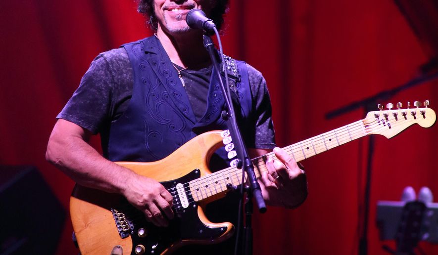 FILE - In this Sept. 18, 2014 file photo, John Oates of the rock band Hall & Oates performs in concert at Pier Six Pavilion in Baltimore. St. Martin’s Press announced Wednesday that Oates is working on a memoir that will draw upon his “pretty detailed” journals to tell an “intimate and fascinating” story about his life and career. The book is currently untitled and scheduled for late 2016. (Photo by Owen Sweeney/Invision/AP, File)