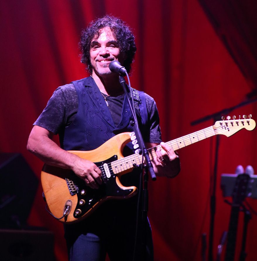 FILE - In this Sept. 18, 2014 file photo, John Oates of the rock band Hall & Oates performs in concert at Pier Six Pavilion in Baltimore. St. Martin’s Press announced Wednesday that Oates is working on a memoir that will draw upon his “pretty detailed” journals to tell an “intimate and fascinating” story about his life and career. The book is currently untitled and scheduled for late 2016. (Photo by Owen Sweeney/Invision/AP, File)