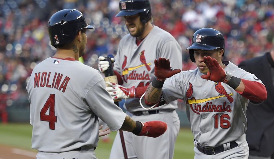 St. Louis Cardinals&#39; Kolten Wong (16) celebrates his two-run home run with Yadier Molina (4) during the second inning of a baseball game against the Washington Nationals, Wednesday, April 22, 2015, in Washington. (AP Photo/Nick Wass)
