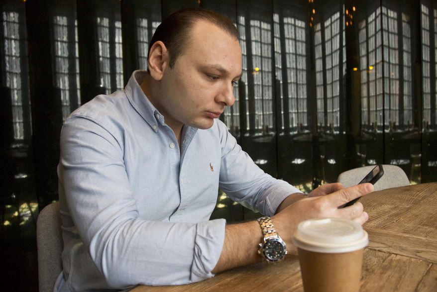 Jacob Tanur, who heads a video production company that employs producers from abroad, reads his phone messages in a conference room, Wednesday, April 15, 2015, in New York. Companies like Tanur's are finding it difficult to get visa's for talent they want to hire from other countries. (AP Photo/Bebeto Matthews)