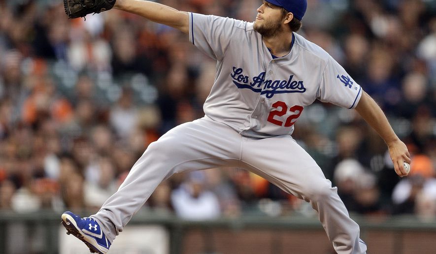 Los Angeles Dodgers&#39; Clayton Kershaw winds up against the San Francisco Giants during the first inning of a baseball game Wednesday, April 22, 2015, in San Francisco. (AP Photo/Ben Margot)