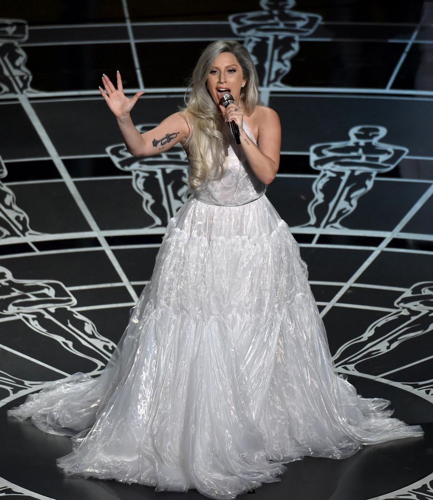 FILE - In this Sunday, Feb. 22, 2015, file photo, Lady Gaga performs at the Oscars at the Dolby Theatre in Los Angeles. Lady Gaga’s icon status is being reaffirmed by the Songwriters Hall of Fame, as she will receive the inaugural Contemporary Icon Award at the Songwriters Hall of Fame on June 19. (Photo by John Shearer/Invision/AP, File)