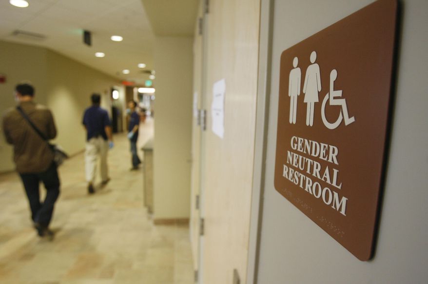 A sign marks the entrance to a gender neutral restroom at the University of Vermont in Burlington, Vt. (Associated Press) **FILE**