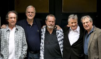 Monty Python cast members from left, Eric Idle, John Cleese, Terry Gilliam, Michael Palin and Terry Jones pose for photographers during a photo in London, June 30, 2014. A 40th anniversary screening of “Monty Python and the Holy Grail” will take place during the Tribeca Film Festival on Friday, April 24, 2015, at the Beacon Theatre in New York. (Photo by John Phillips Invision/AP, File) ** FILE **