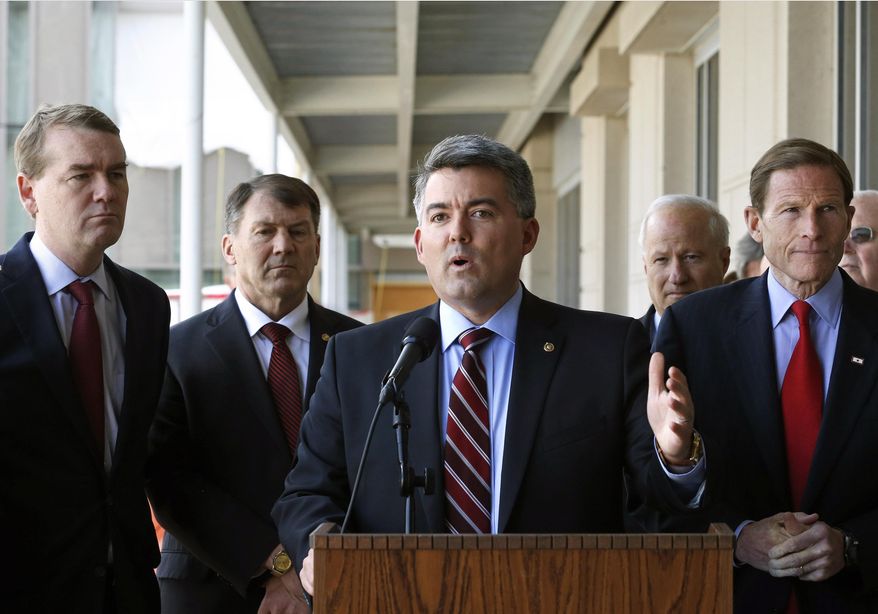 Sen. Cory Gardner, R-Colo., speaks to members of the media following a U.S. Senate delegation tour of the over-budget Veterans Administration hospital complex, which is under construction, in Aurora, Colo. (AP Photo/Brennan Linsley)