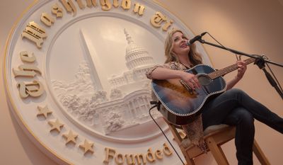 Miss Sweeney of Austin, Texas, who blazed onto the country music scene in 2010 and by 2013 was nominated as one of the industry's rising female stars, performed a few songs for the veterans and their families, as children danced and sang along in the crowd. (Khalid Naji-Allah/Special to The Washington Times)