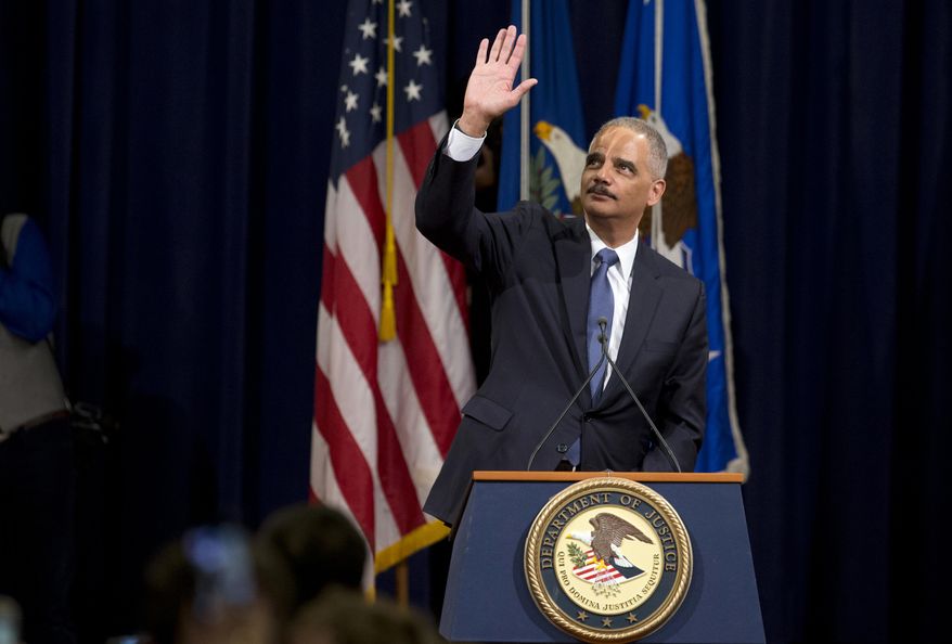 Attorney General Eric Holder waves to Justice Department during a farewell gathering at the Justice Department in Washington, Friday, April 24, 2015. Holder was bidding farewell to the Justice Department on Friday after six years as the nation's top law enforcement official. Holder was addressing employees at an afternoon ceremony one day after his chosen successor, Loretta Lynch, was confirmed by the Senate following a months-long delay. (AP Photo/Manuel Balce Ceneta)