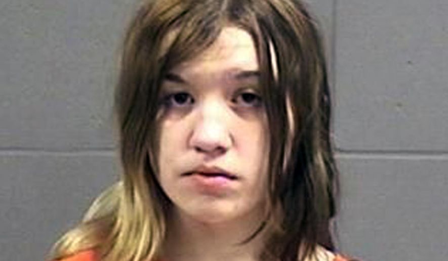 This photo provided Friday, April 24, 2014 by the Oneida County, Wisconsin, Sheriff’s Office shows Ashlee Martinson, 17. Martinson is is charged with fatally stabbing her mother Jennifer Ayers, 40, and shooting her stepfather Thomas Ayers, 37, on March 8 at the family's home in the Town of Piehl, Wis. (Oneida County Sheriff’s Office via AP)