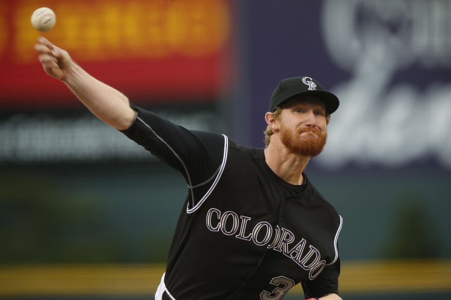 Colorado Rockies starting pitcher Eddie Butler works against the San Francisco Giants in the first inning of a baseball game Friday, April 24, 2015, in Denver. (AP Photo/David Zalubowski)