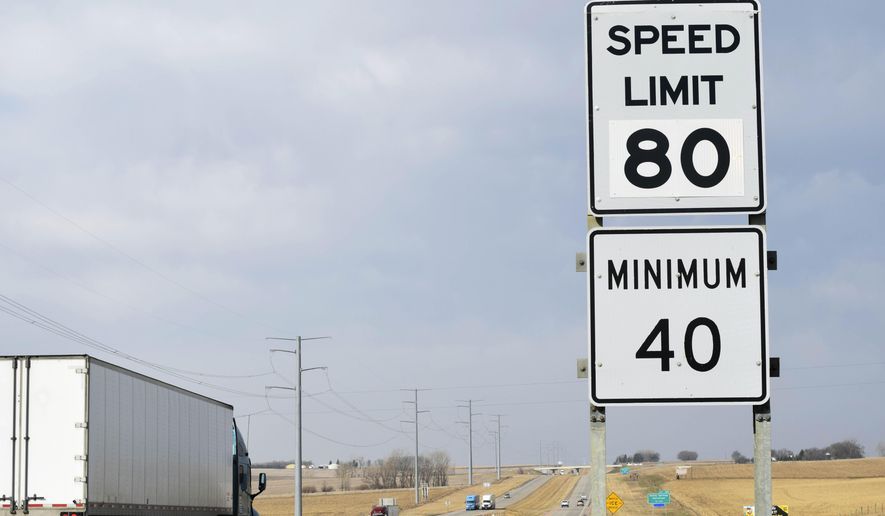 FILE - In this April 1, 2015 file photo, a semi-truck passes by a newly posted 80 mph speed limit sign on Interstate 90 near Brandon, S.D. Travelers on a roughly 55-mile stretch of I-90 west of Rapid City to the Wyoming border may not be able to drive the new 80 mph speed limit for much longer under recommendations proposed by the Department of Transportation. The state Transportation Commission will take public comment during a hearing at the end of May on the proposal, which would drop the speed limit long-term on that portion to 75 mph. (AP Photo/Kevin Burbach, File)
