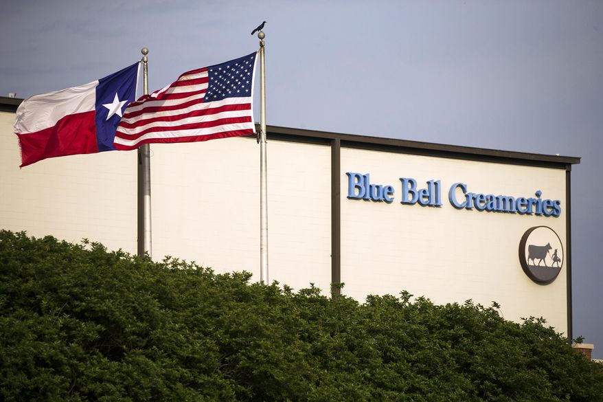 Flags flutter in the breeze outside of the Blue Bell Creameries on Thursday, April 23, 2015, in Brenham, Texas. Blue Bell issued its first recall in its 108 year history earlier this week after its products were linked to Listeria cases in four states. (Smiley N. Pool/The Dallas Morning News via AP)